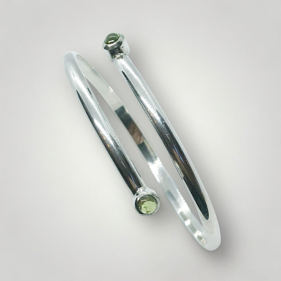 Adjustable, sterling silver birthstone bangle. Stone shown here is Peridot.