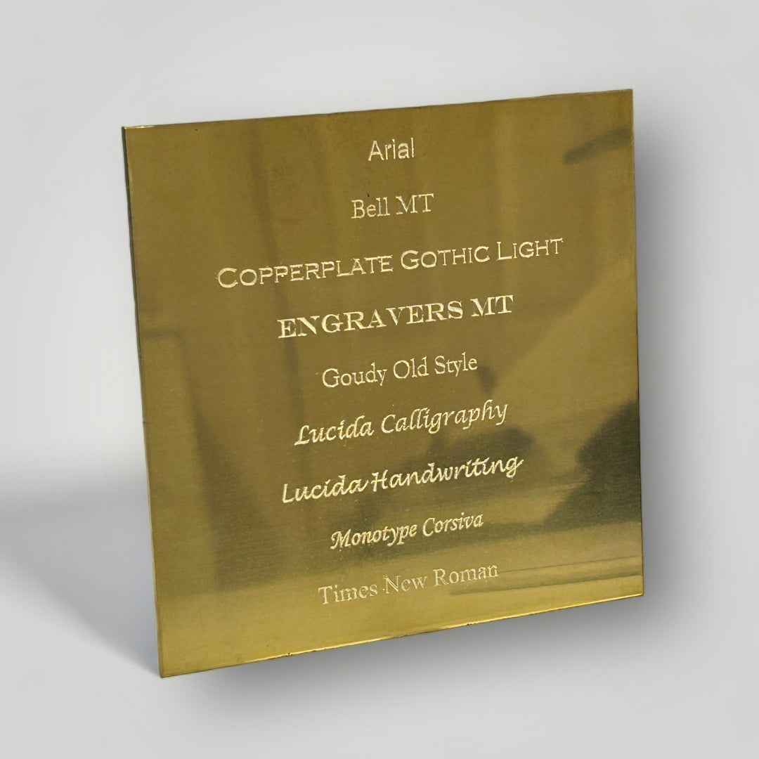A list of font choices engraved on a square, brass plate