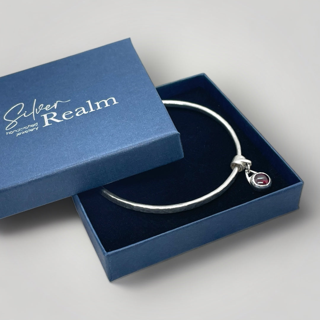 Garnet charm bangle in sterling silver - other gemstones available on request.
