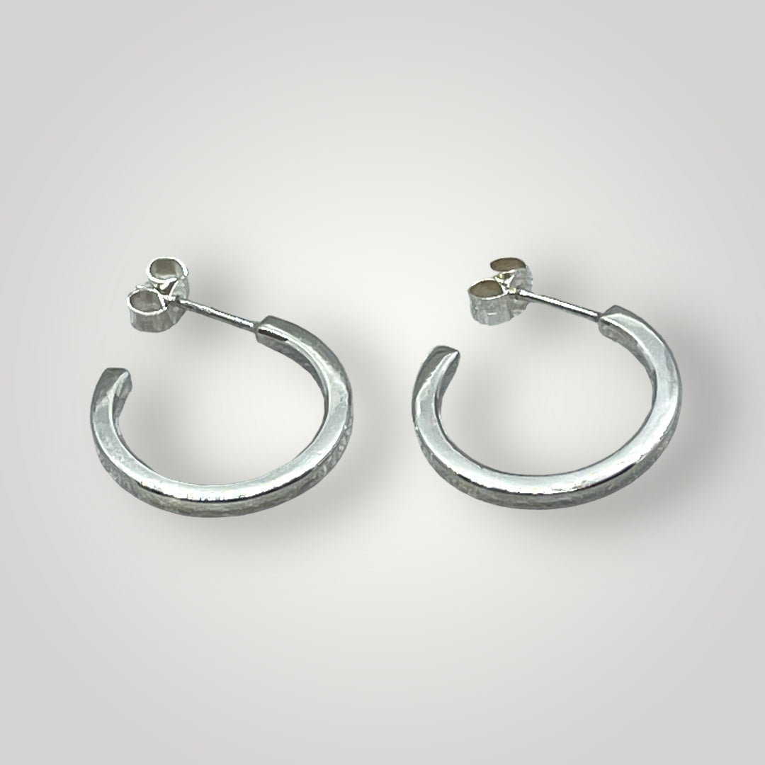 Sterling silver hoop earrings with butterfly closure
