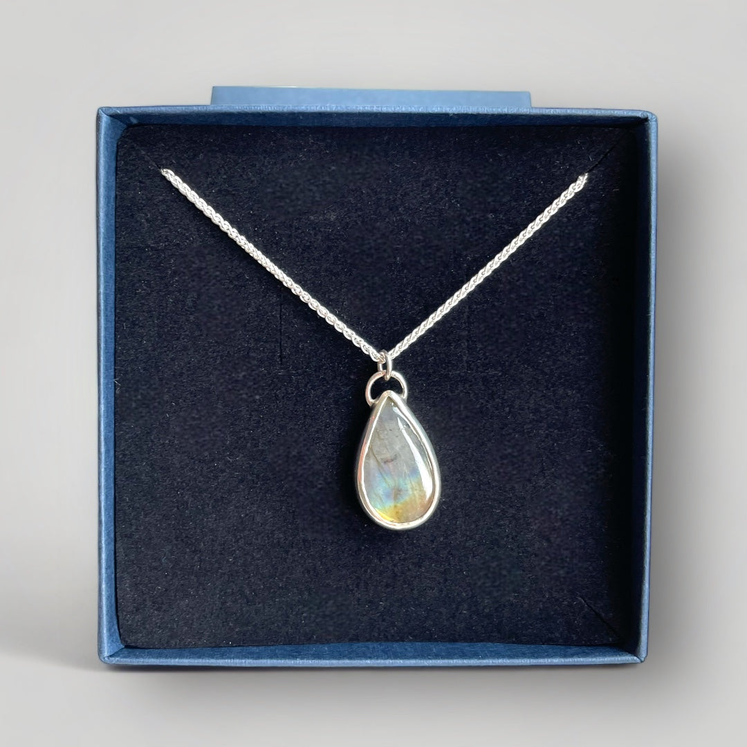 Labradorite and sterling silver teardrop pendant on a sterling silver chain with leaf detail on reverse