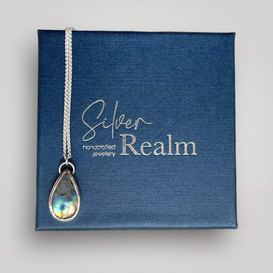 Labradorite and sterling silver teardrop pendant on a sterling silver chain with leaf detail on reverse