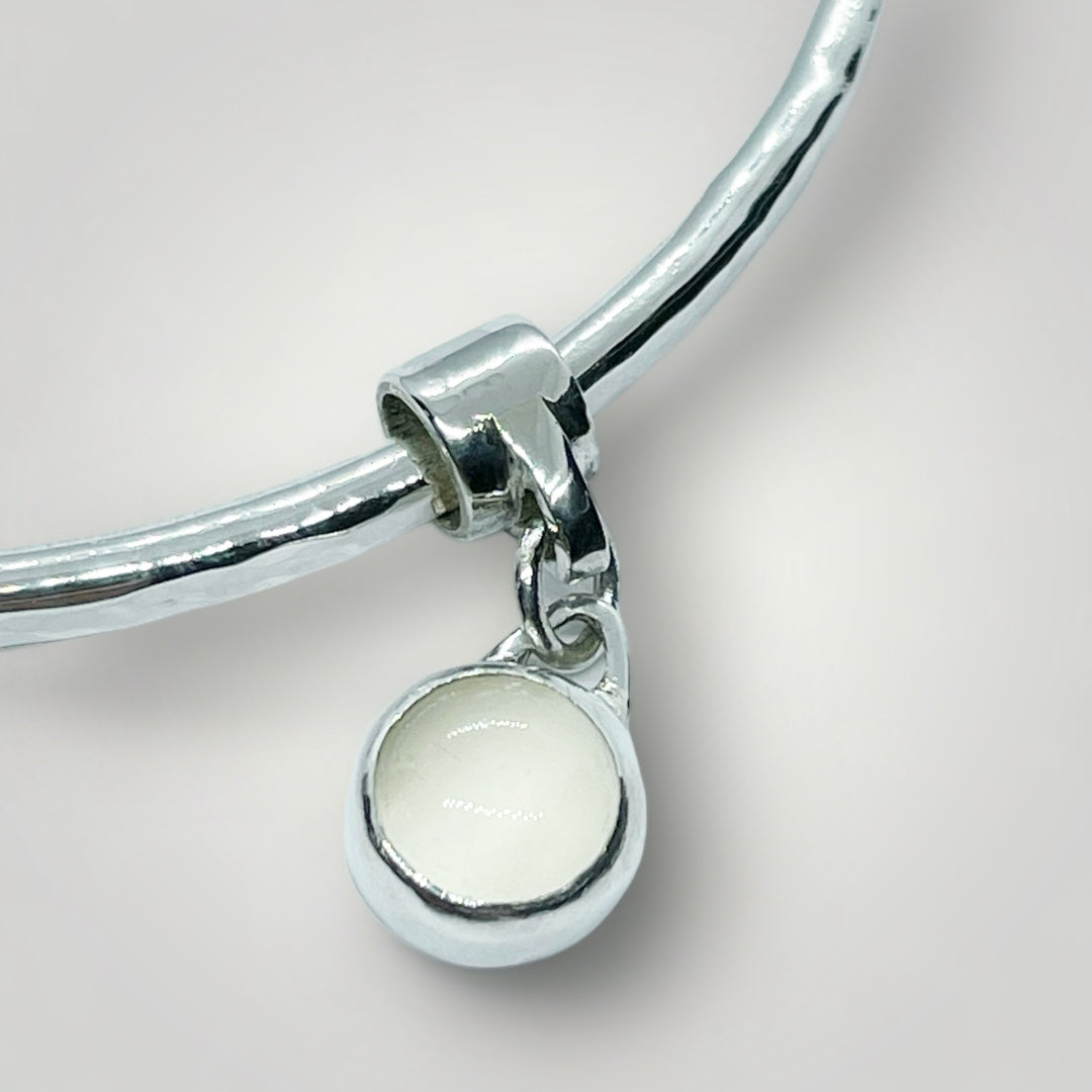 Moonstone charm bangle in sterling silver.
