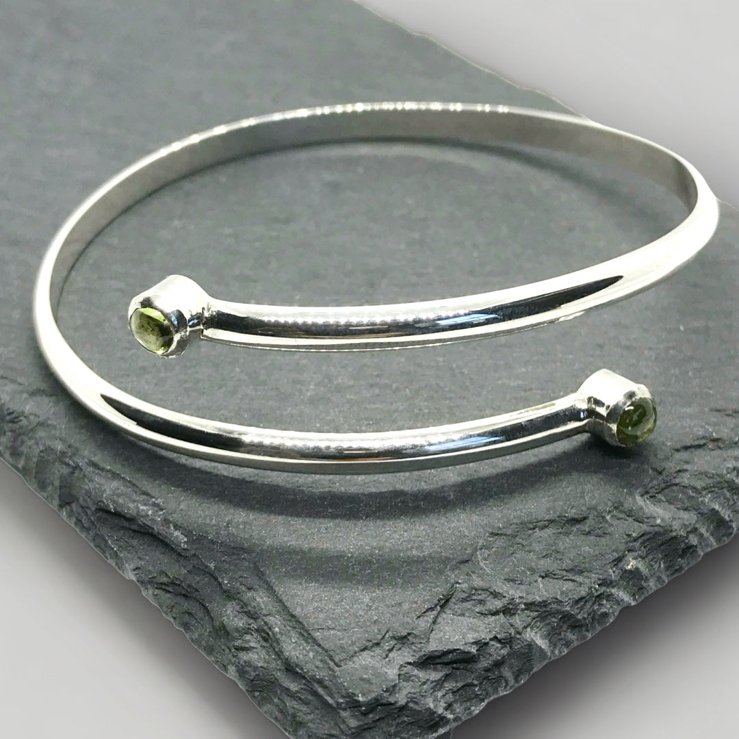 Adjustable, sterling silver birthstone bangle. Stone shown here is Peridot.