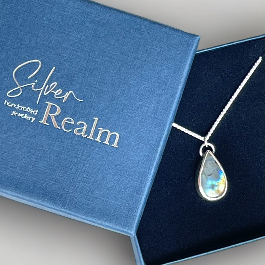 Labradorite and sterling silver teardrop pendant on a sterling silver chain with leaf detail on reverse