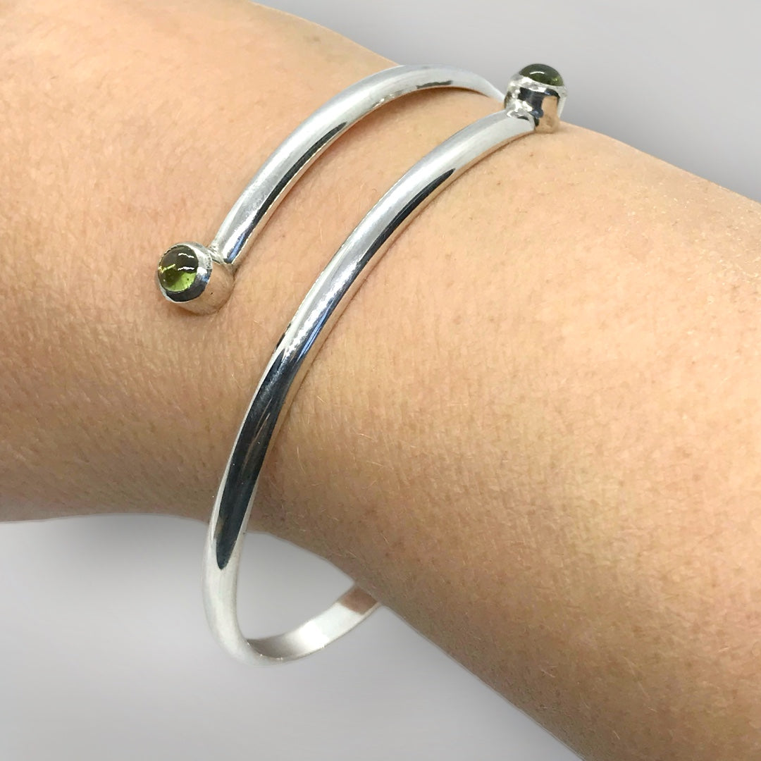 Adjustable, sterling silver birthstone bangle. Stone shown here is Peridot.
