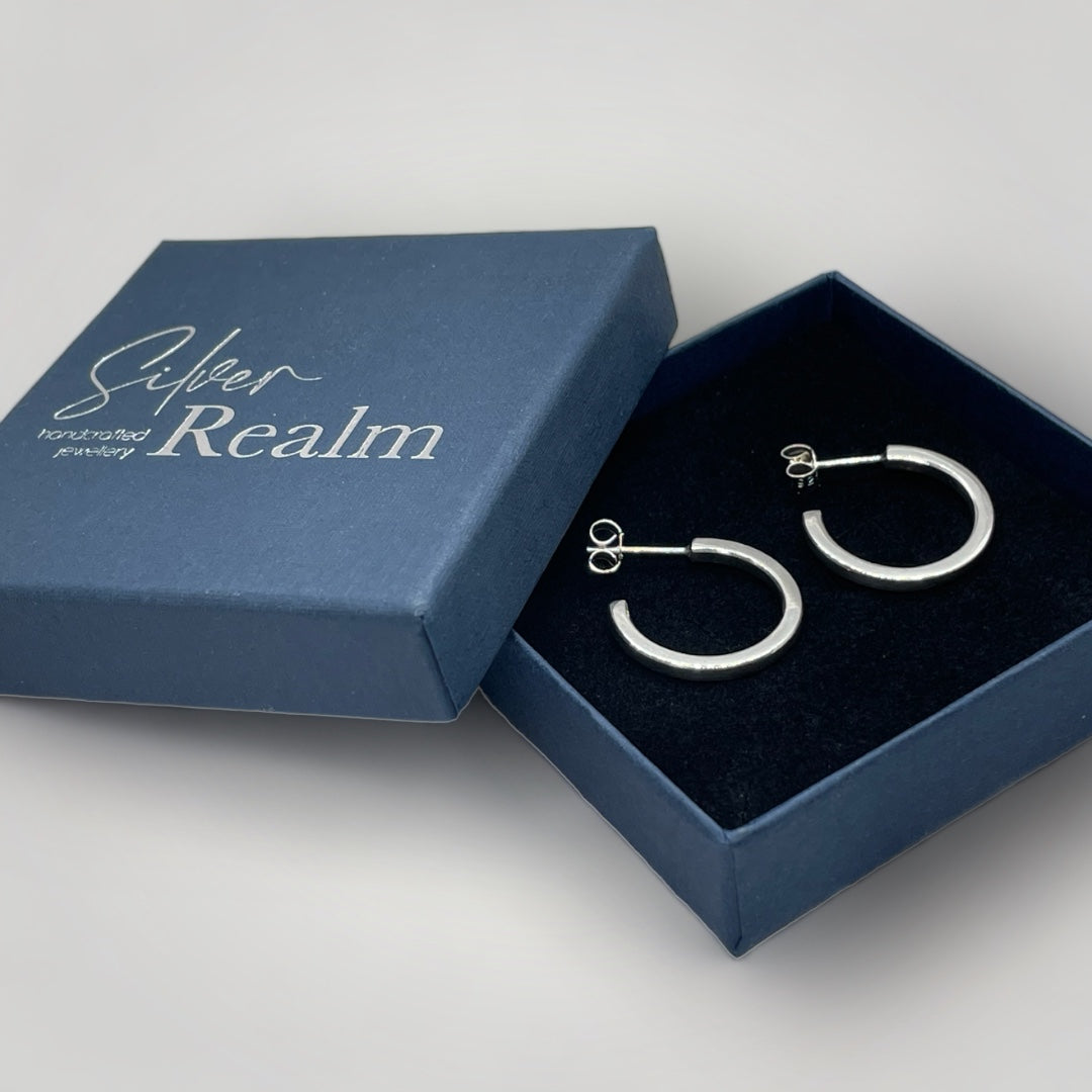 Sterling silver hoop earrings with butterfly closure