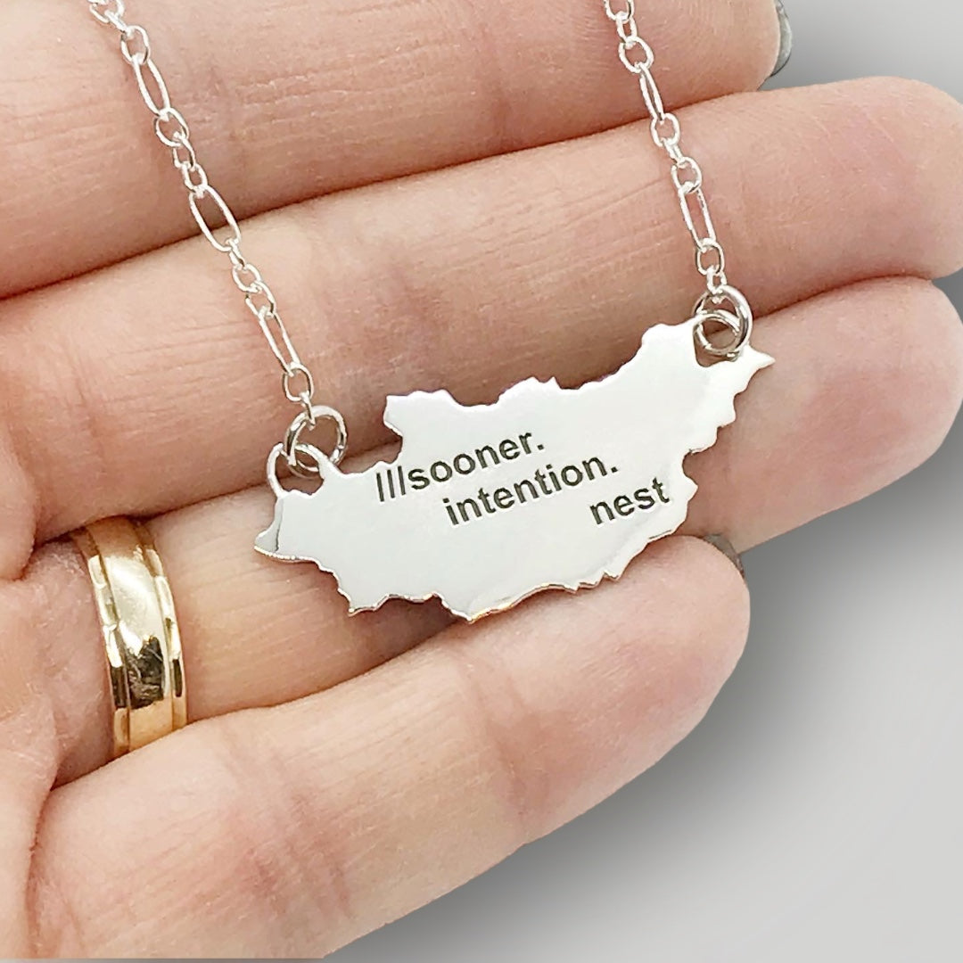 A sterling silver what3words pendant in the shape of your chosen country/state