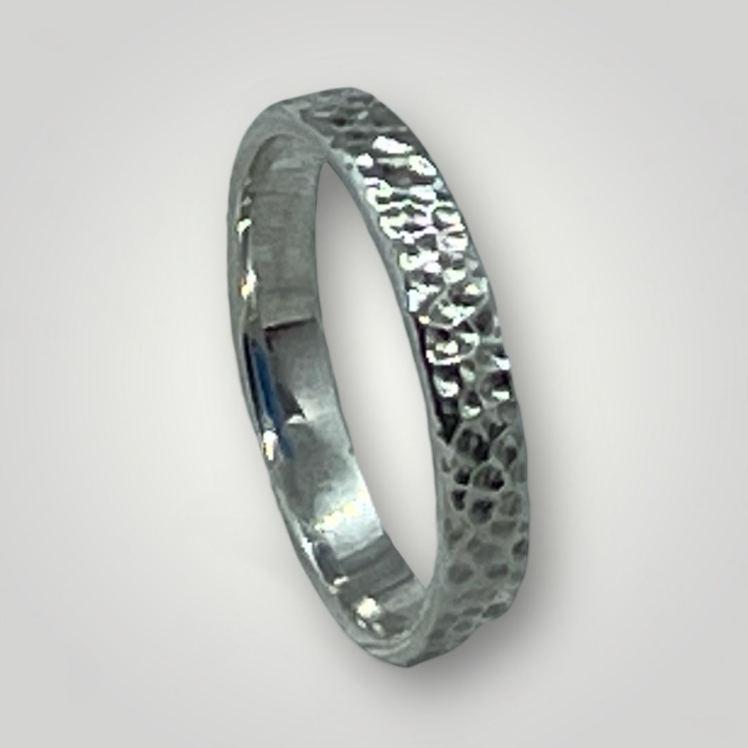 A textured, sterling silver ring