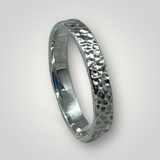 A textured, sterling silver ring
