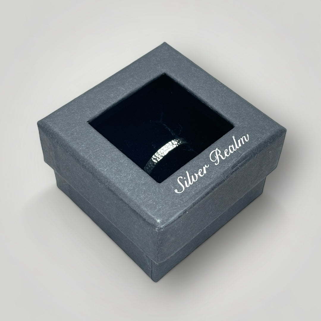 A textured sterling silver ring