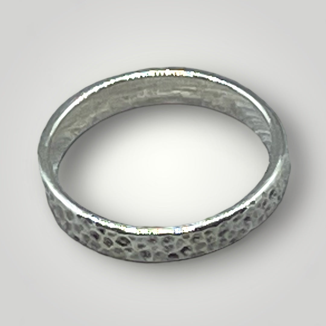 A textured, sterling silver ring