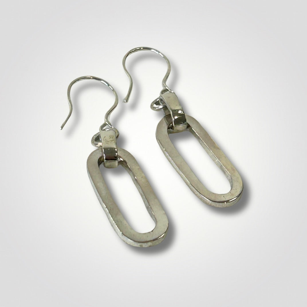 Reverse view of sterling silver long loop earrings showing handmade ear wires