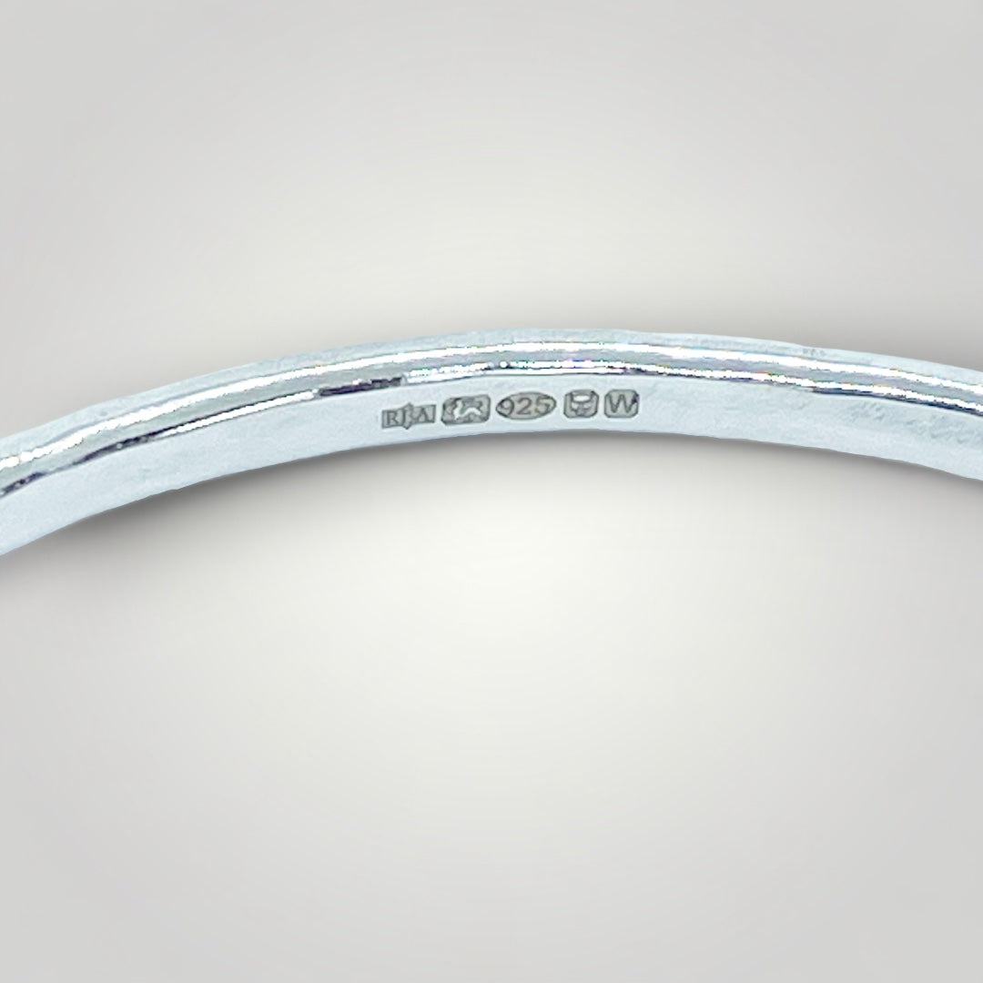 close up of the hallmark on a Silver Realm sterling silver bangle