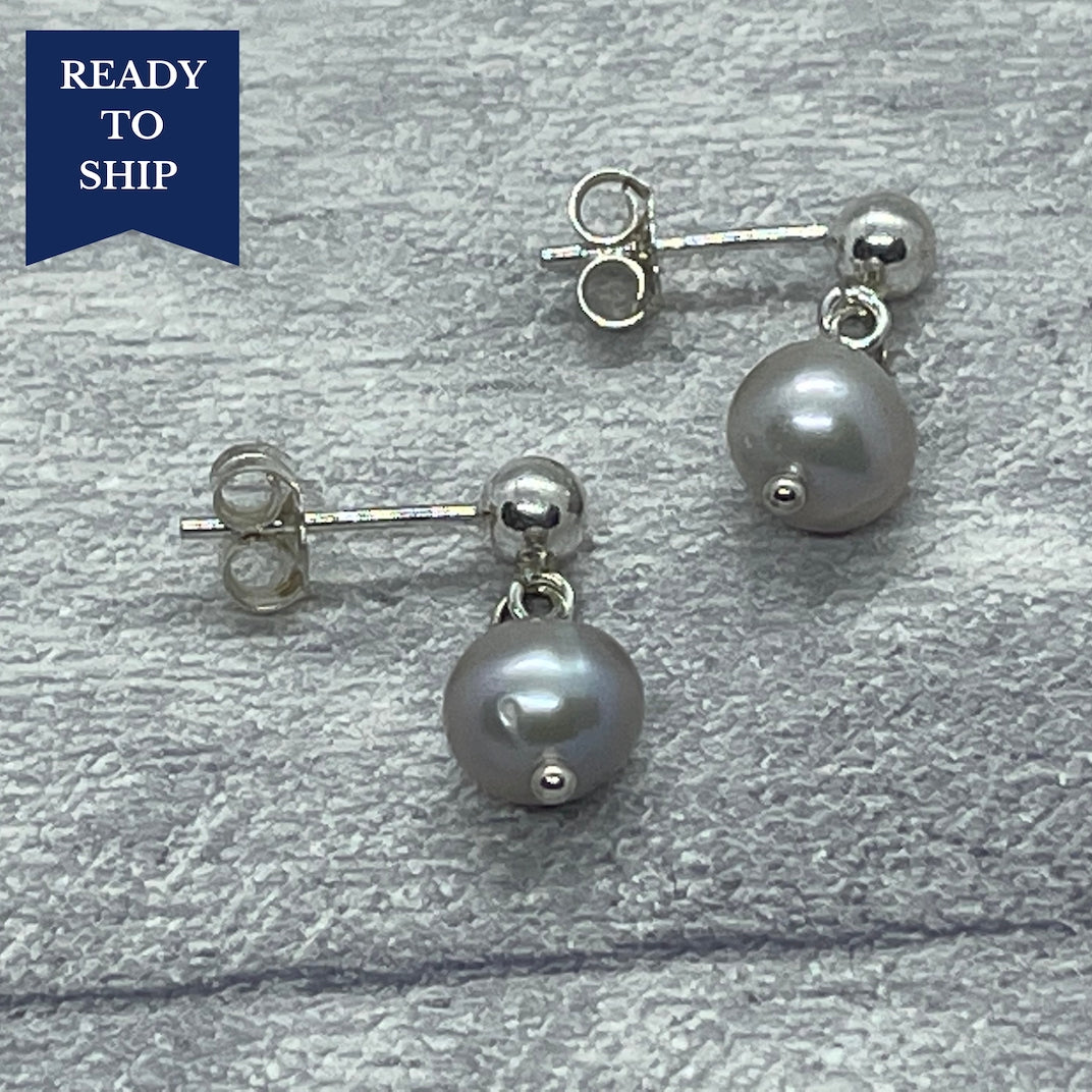 Silver, freshwater, cultured Pearl and sterling silver earrings.