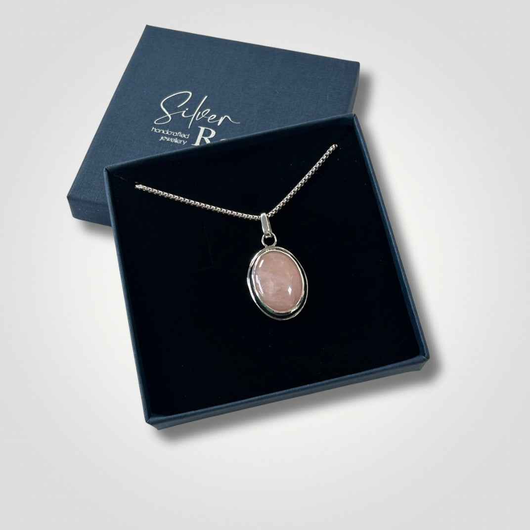 Rose quartz sterling silver pendant necklace displayed in an open Silver Realm jewellery box