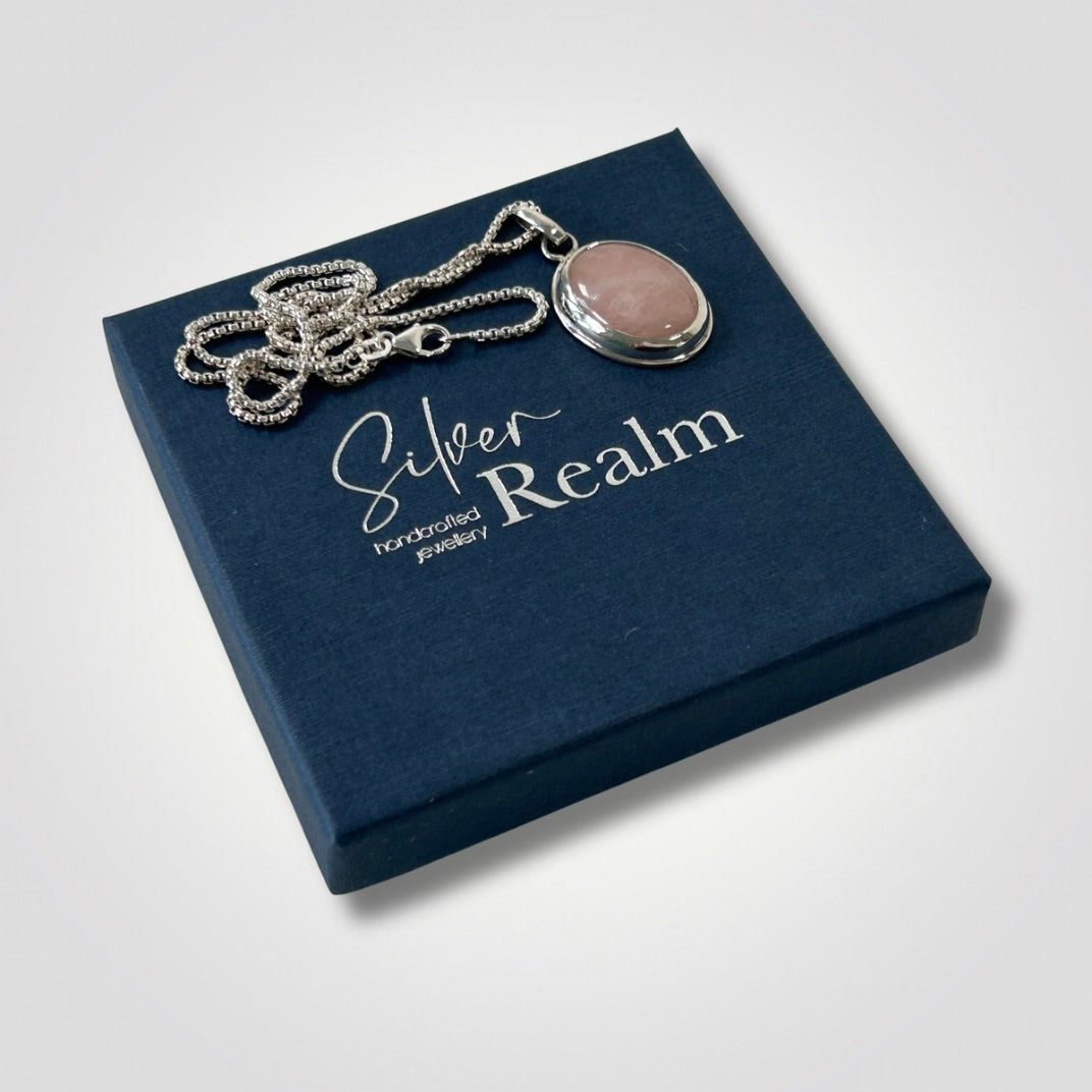 Rose quartz sterling silver pendant necklace displayed on a Silver Realm jewellery box