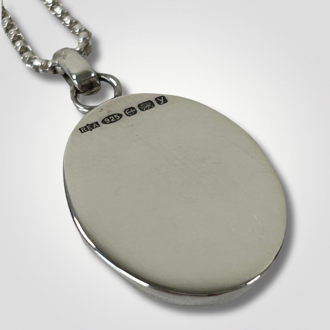 Close up of the hallmark on the reverse of a Rose Quartz pendant necklace
