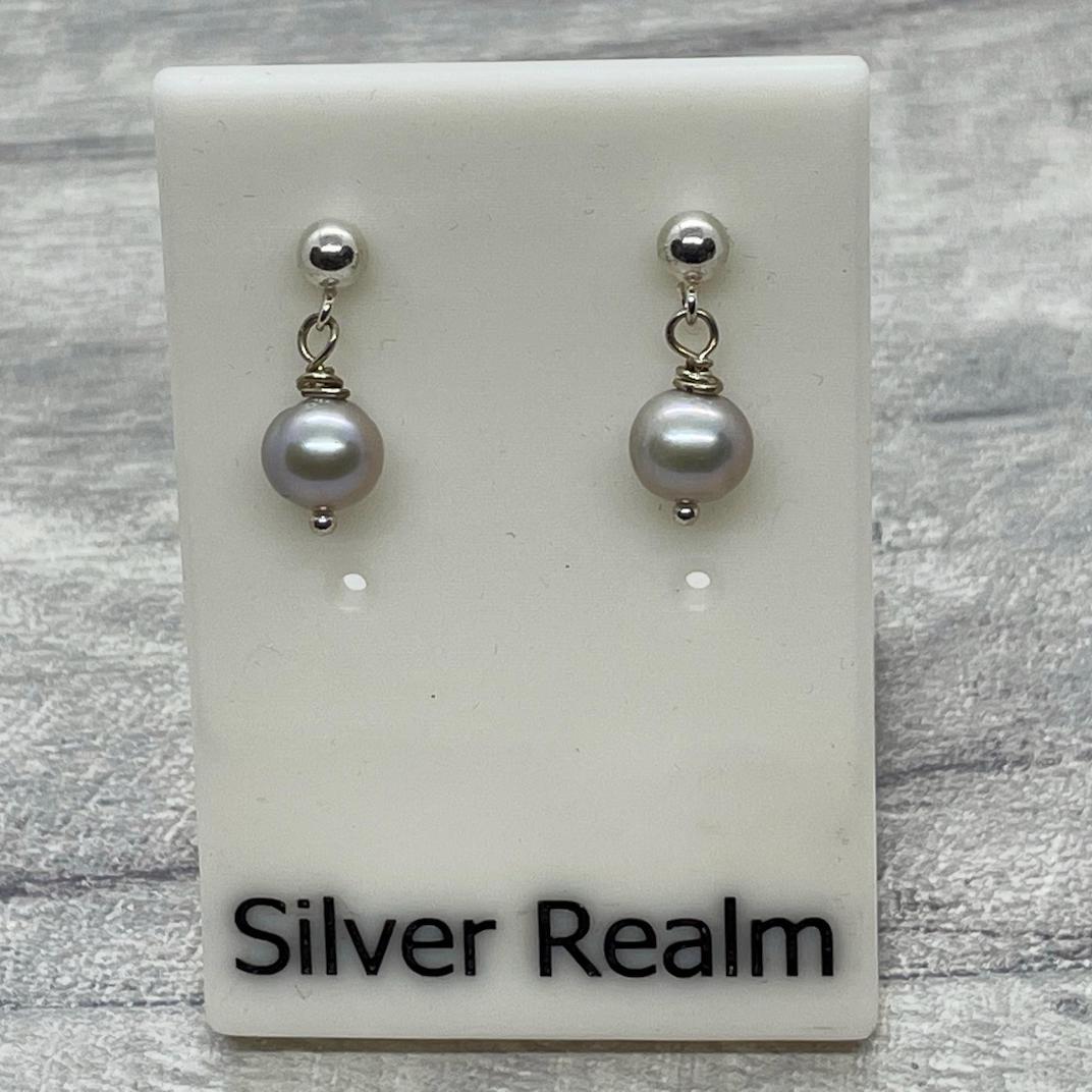Silver, freshwater, cultured Pearl and sterling silver earrings.