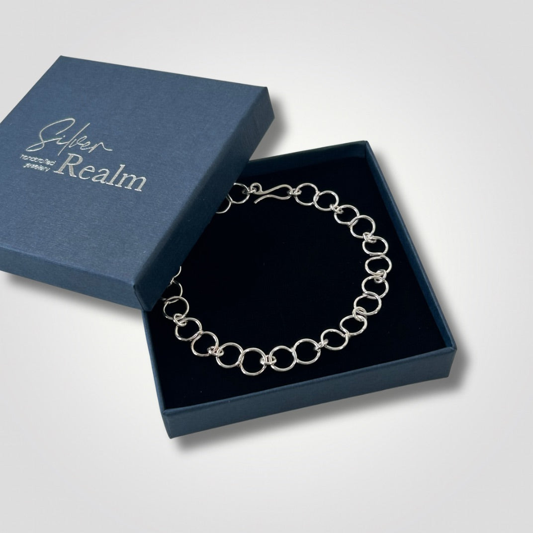 Sterling silver circle link bracelet with handmade hook clasp in side a Silver Realm branded gift box