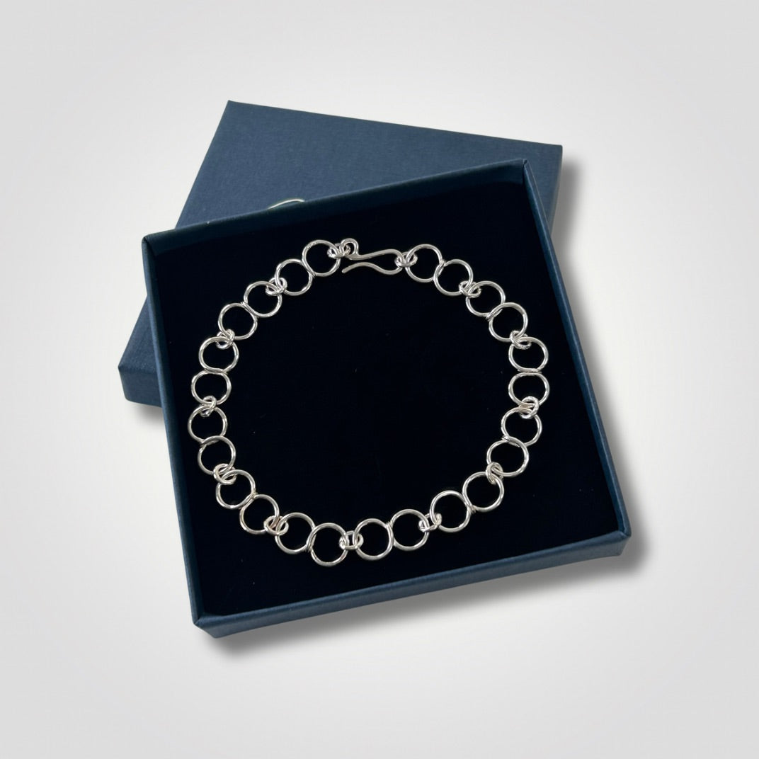 Sterling silver circle link bracelet with handmade hook clasp in open gift box