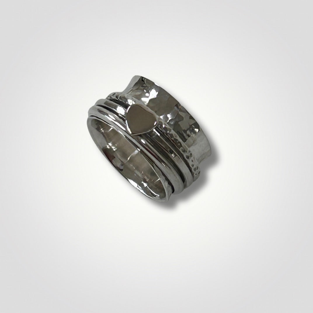 Handmade sterling silver hammered spinner ring with heart detail
