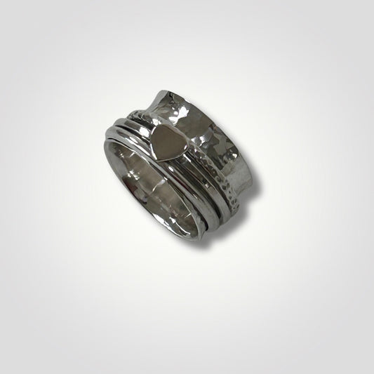 Handmade sterling silver hammered spinner ring with heart detail