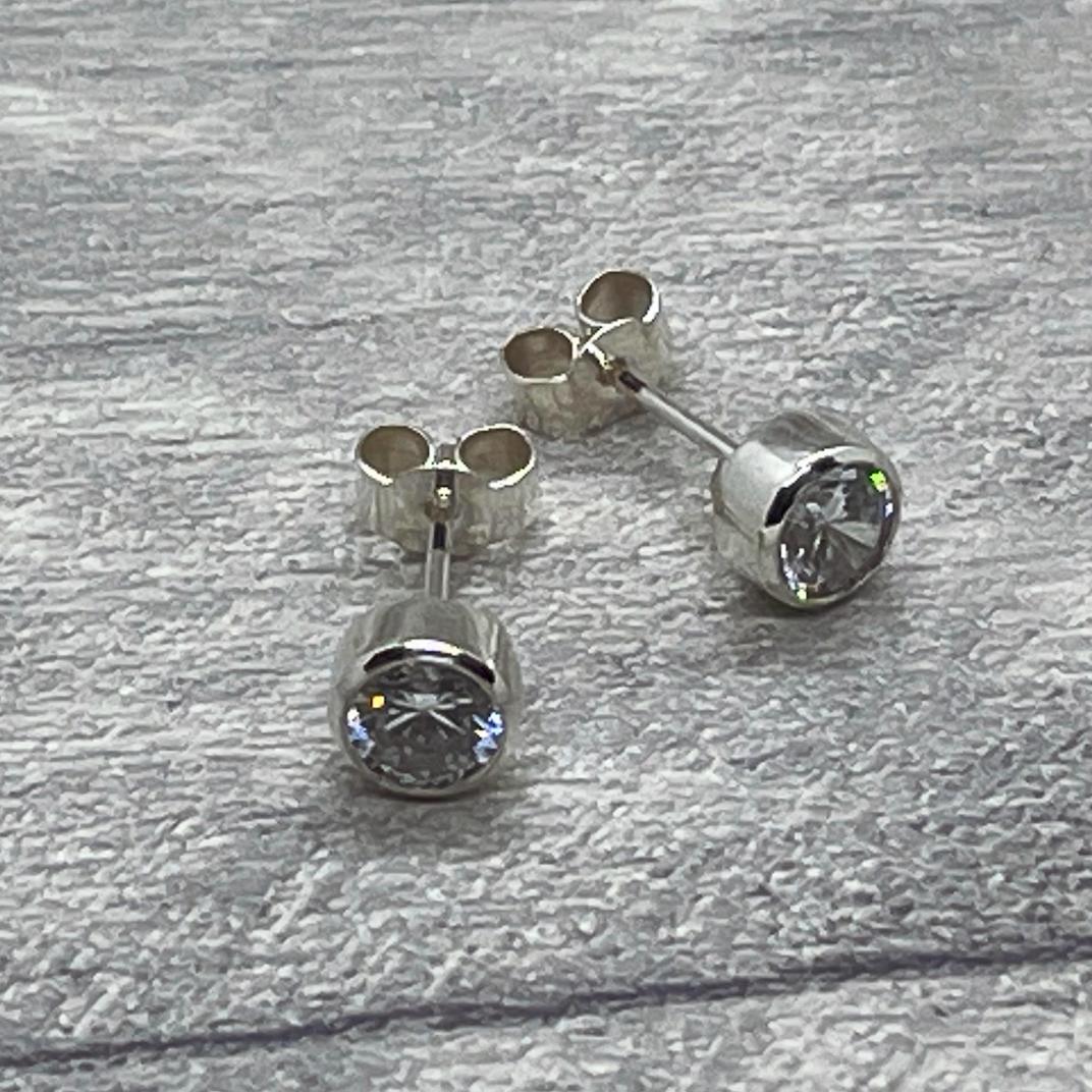 Cubic Zirconia stud earrings in sterling silver.