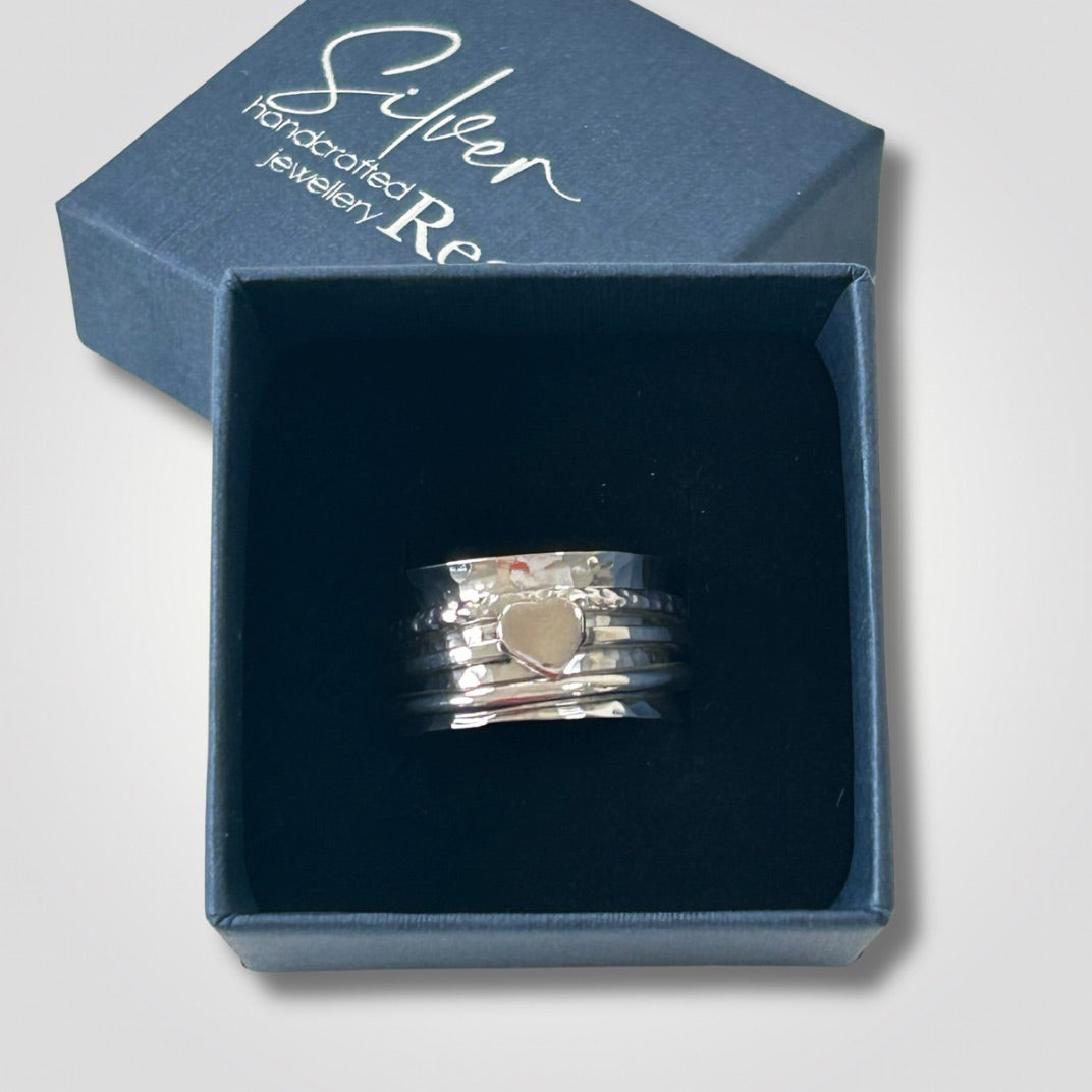Hammered sterling silver spinner ring with three moving bands and heart
