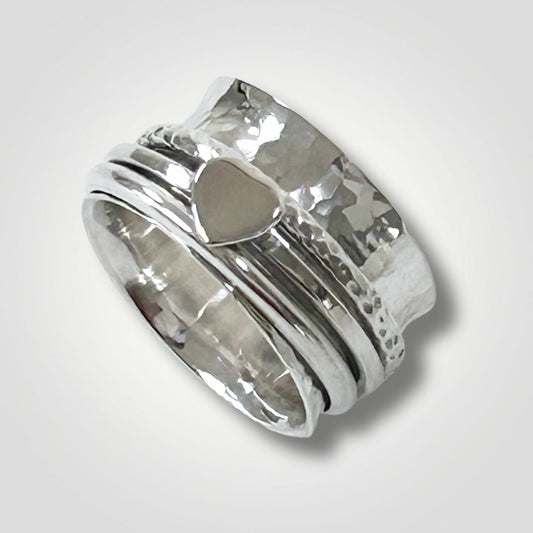 Handmade sterling silver hammered spinner ring with heart detail