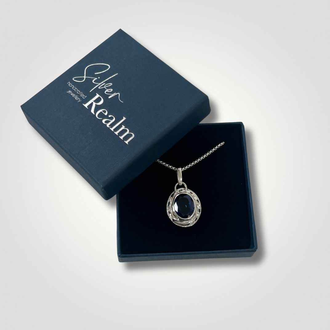 Synthetic sapphire silver pendant in a Silver Realm gift box