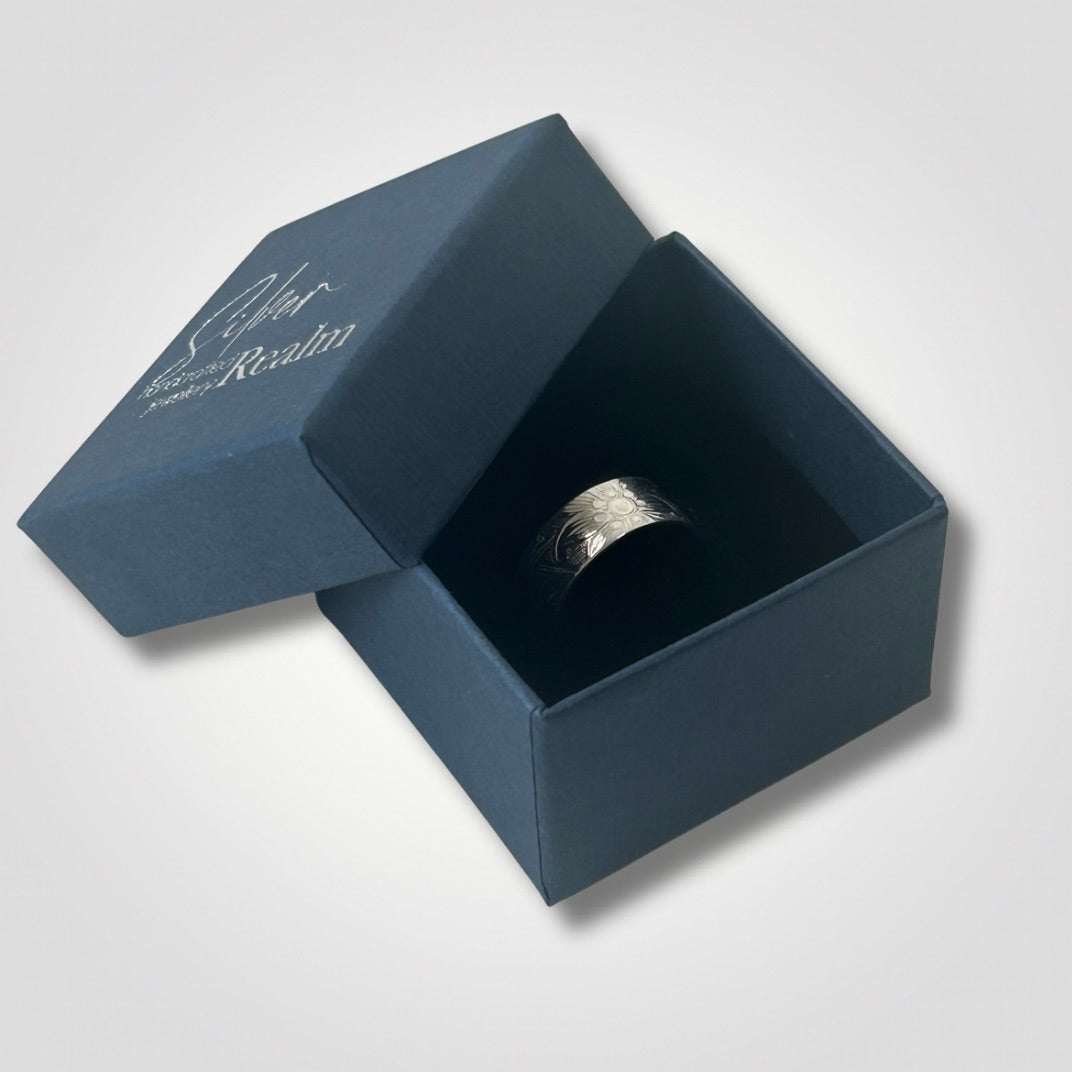 Wide sterling silver ring with flower and swirl texture in Silver Realm jewellery box