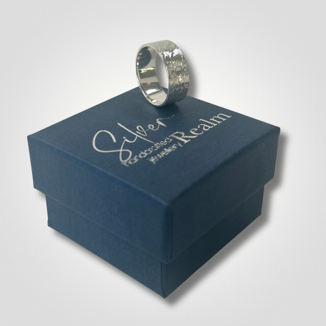 Floral swirl textured sterling silver ring displayed on Silver Realm jewellery box