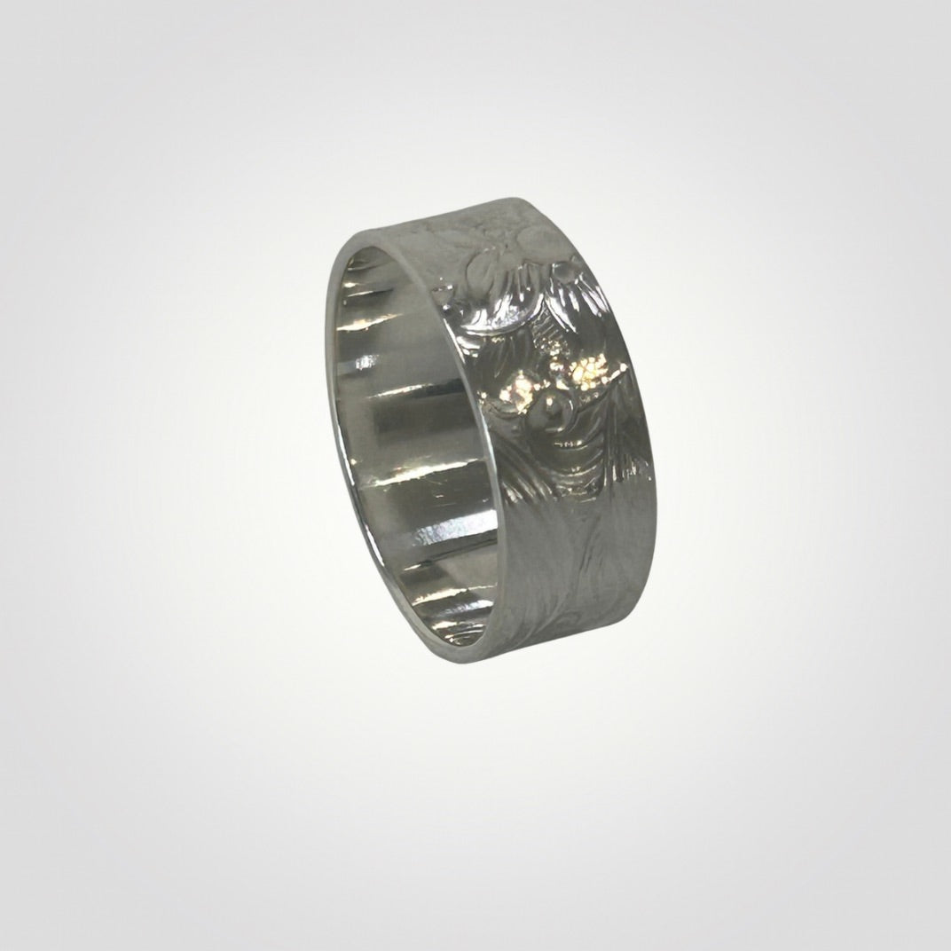 Textured sterling silver wide ring with floral and swirl detail
