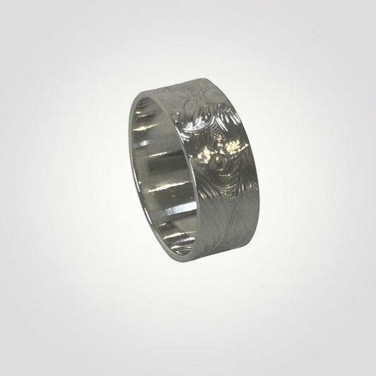 Textured sterling silver wide ring with floral and swirl detail