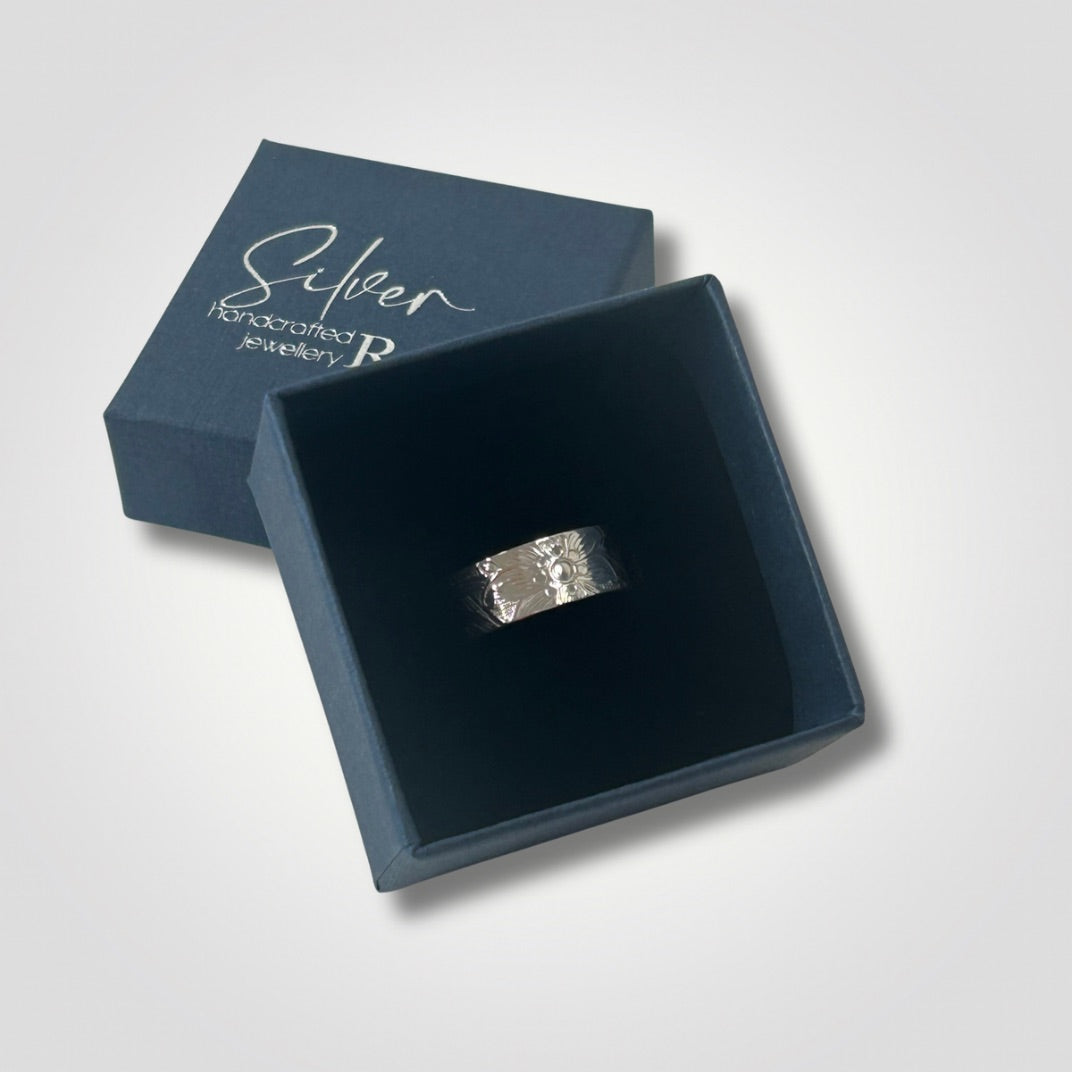 Sterling silver floral textured ring presented inside Silver Realm gift box