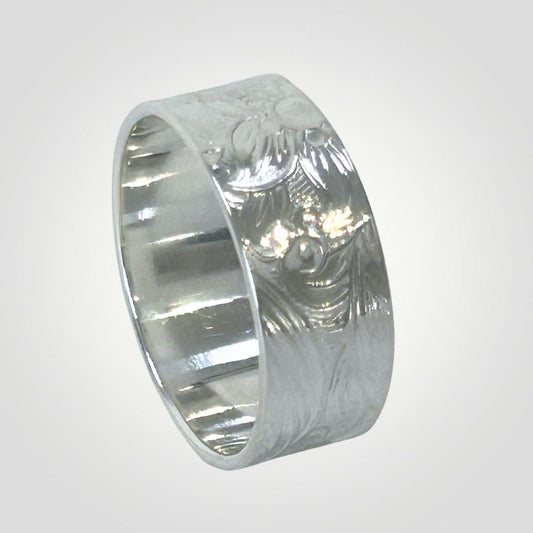 Textured sterling silver wide ring with floral and swirl detail