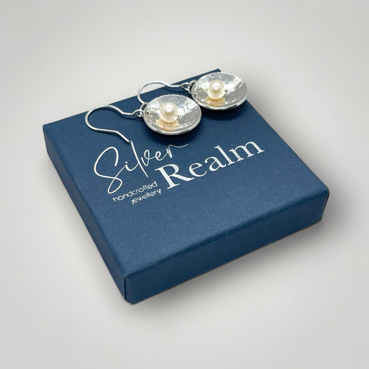 Pearl and hammered sterling silver dangly earrings