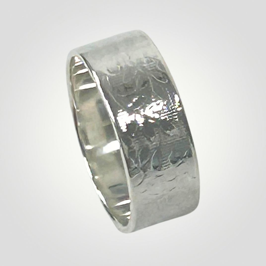 Wide sterling silver ring with textured leaf detail